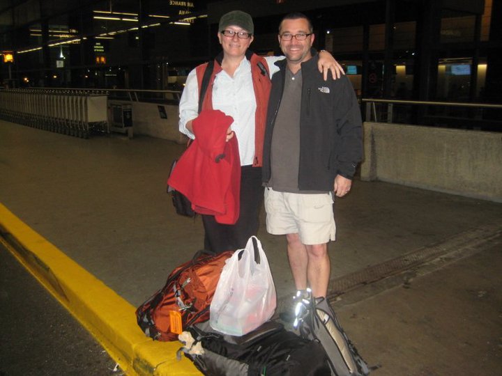 Betsy and Warren posing with 2 backpacks