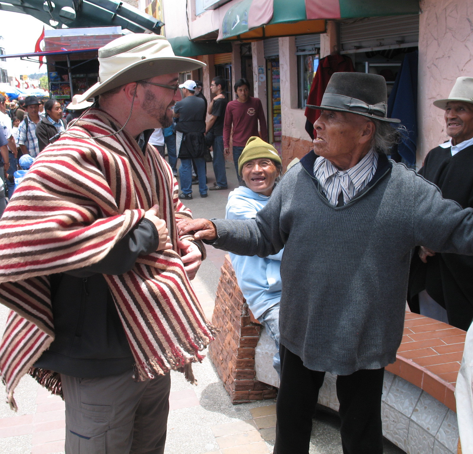 Artisan tries to sell Warren a poncho