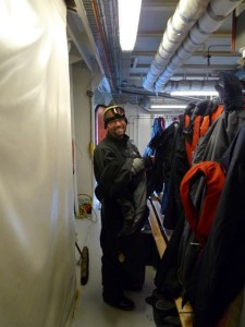 Warren in the mudroom of the ship in Antarctica